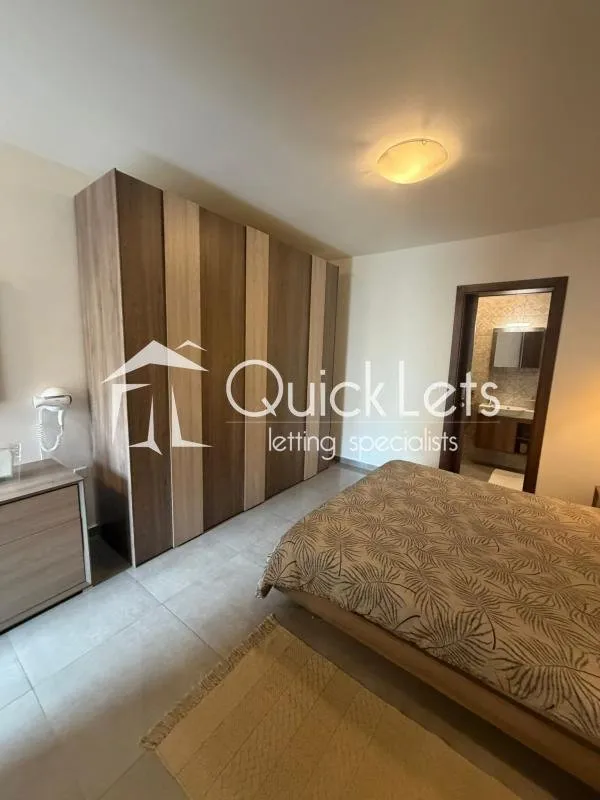 Bright airy two-bedroom apartment with two bathrooms and front terrace