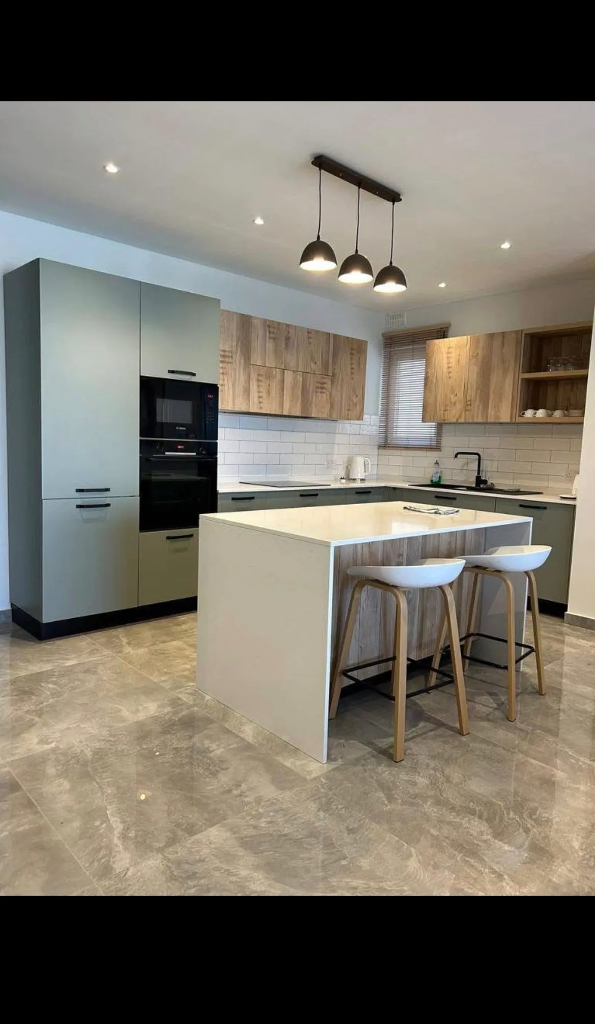 Large Open Plan Kitchen/Living/Dining Area Leading to Balcony with Distant Sea Views