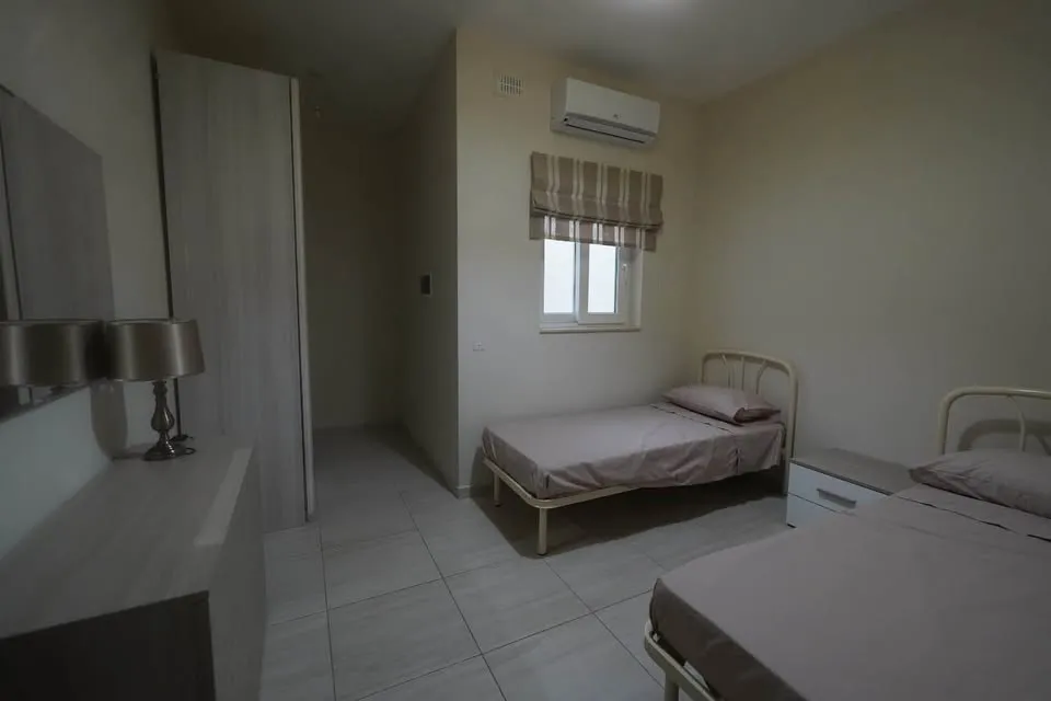 A bedroom in a shared apartment in Swieqi